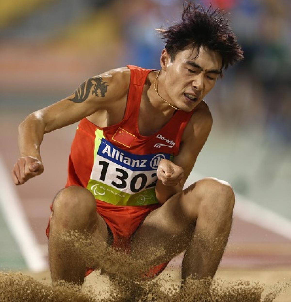 Guangxu Shang of China competes in the men's long jump T37.