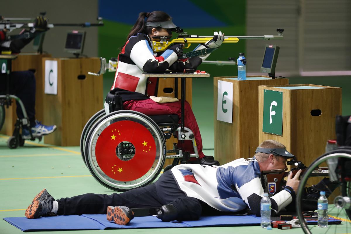 Women in a wheelchair doing para sport shooting