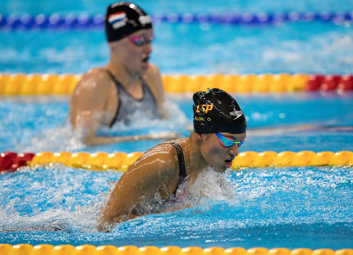 Heads of two swimmers above the water