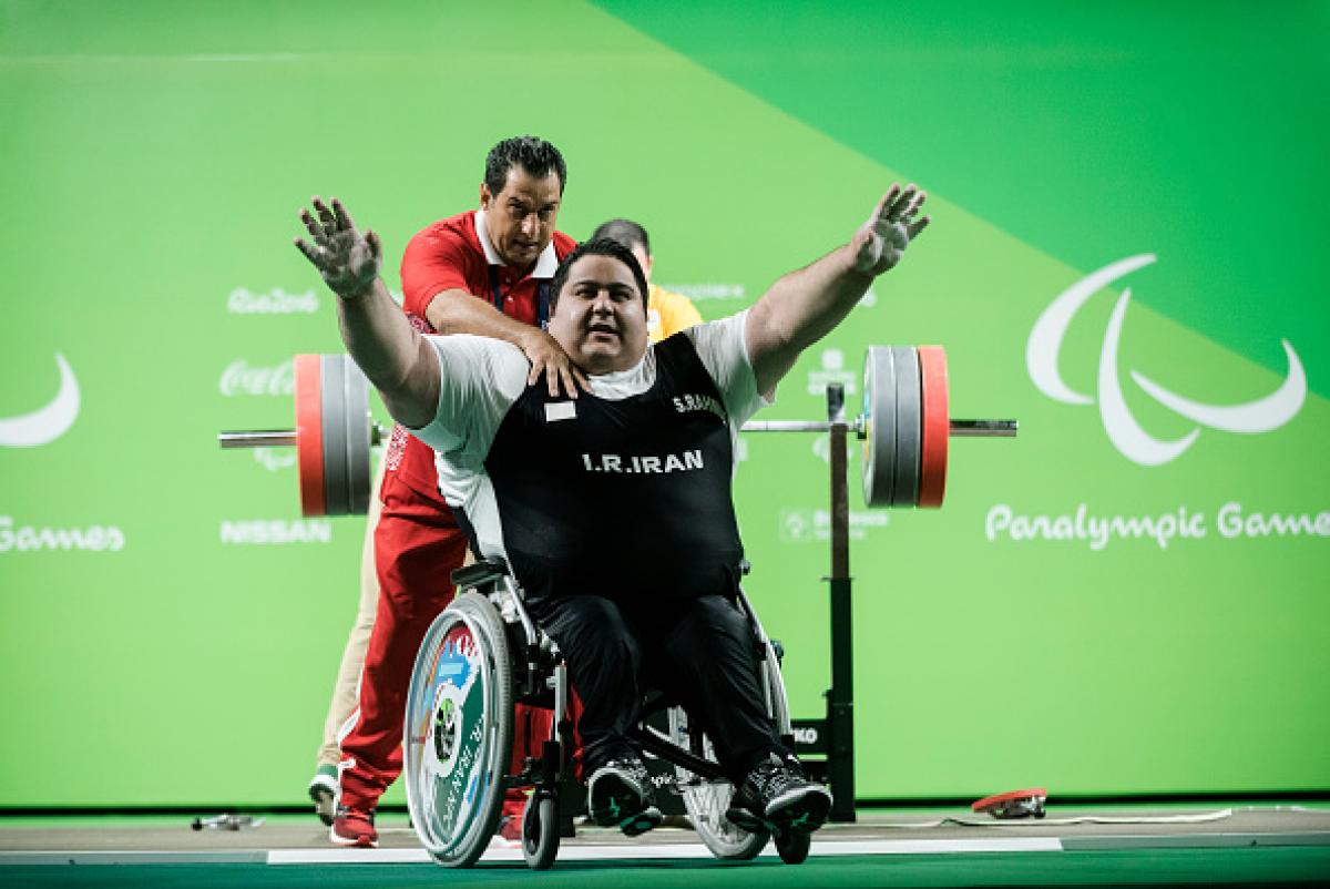 Siamand Rahman of Iran celebrates his new world record on the Powerlifting - Men's +107kg Group A at Riocentro Pavillon 2 at the Rio 2016 Paralympic Games.