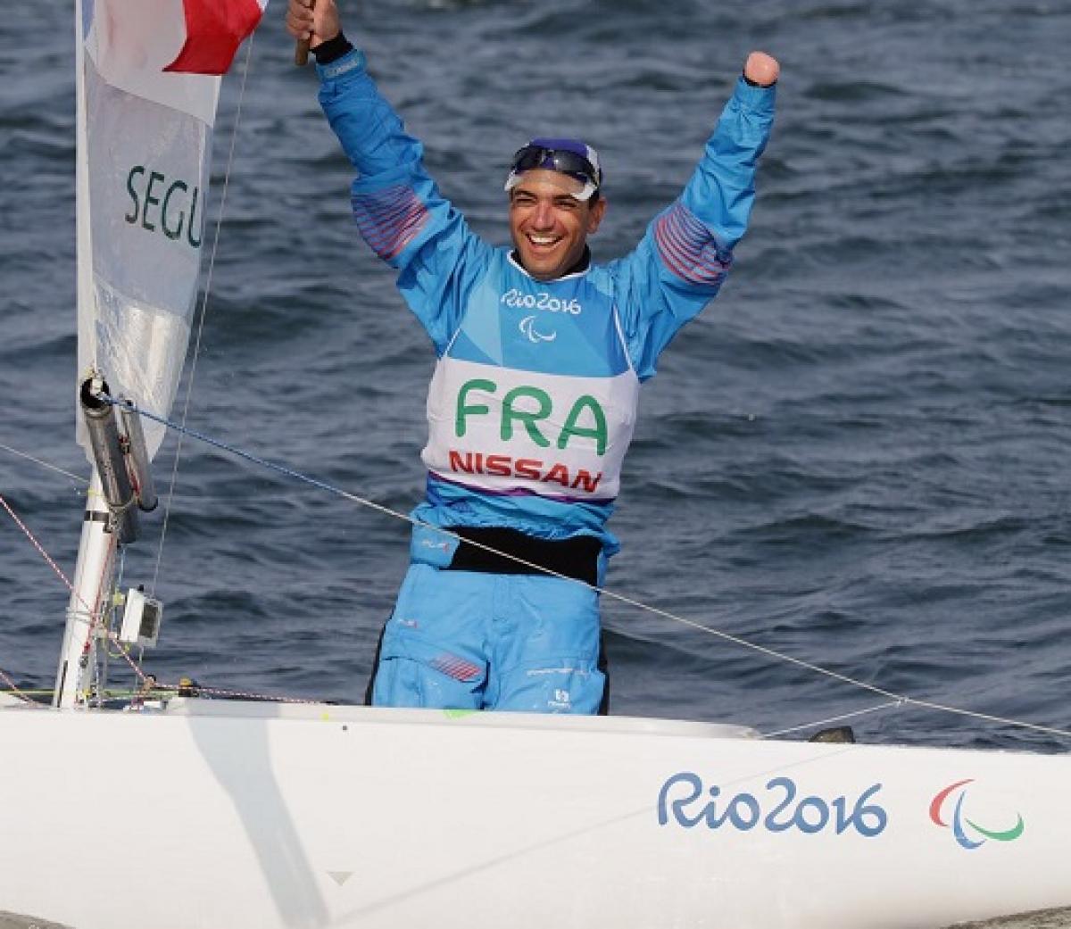 Damien Seguin Damien Seguin celebrates winning sailing gold in Rio de Janeiro