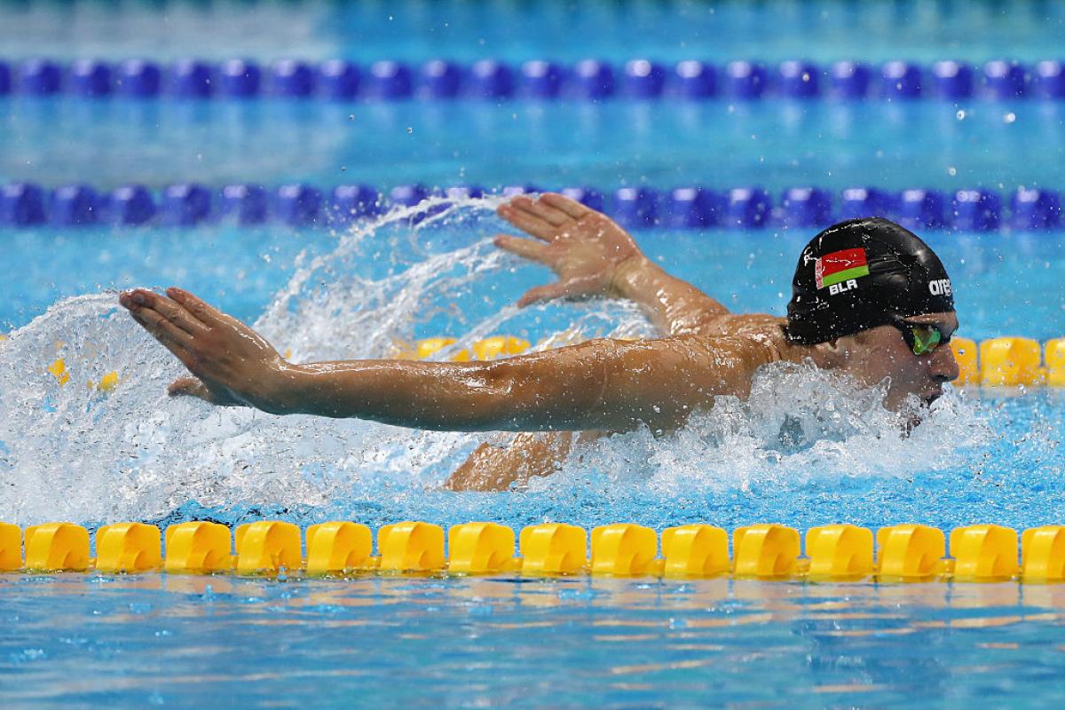 Belarus - Ihar Boki Male swimmer in water competing in butterfly stroke