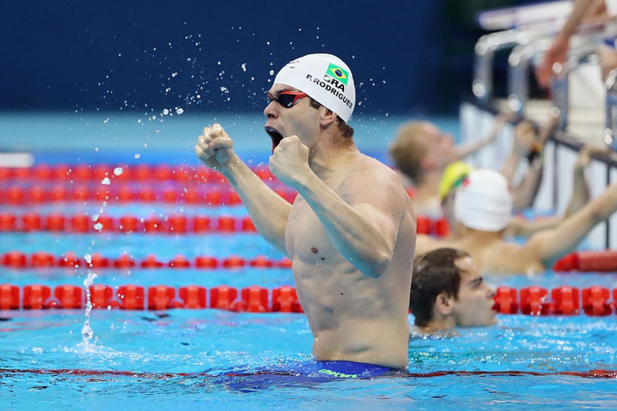 Brazilian swimmer Phelipe Rodrigues celebrating in the pool.