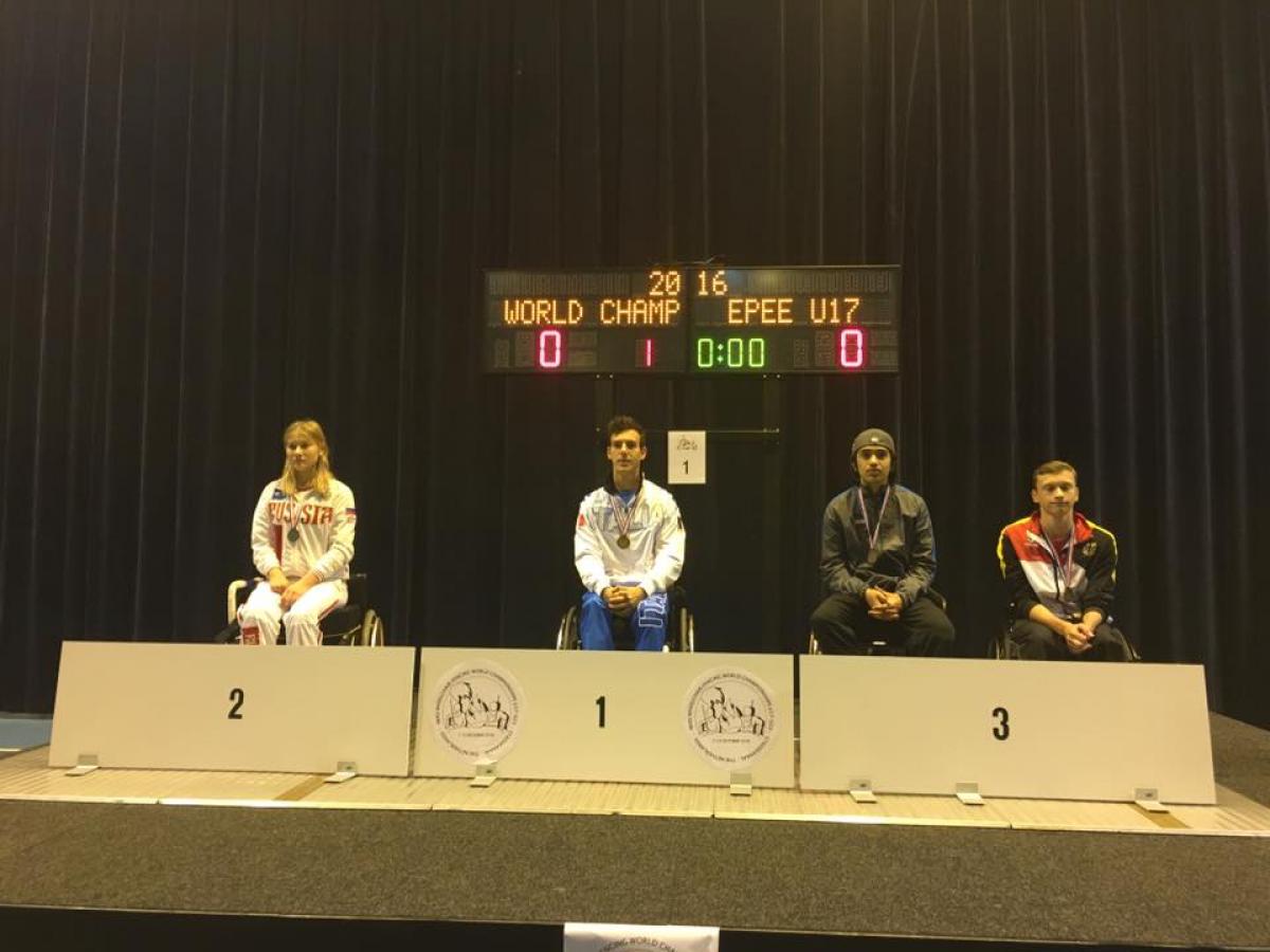 Emanuele Lambertini - Italy - wheelchair fencing Podium with three athletes in wheelchairs