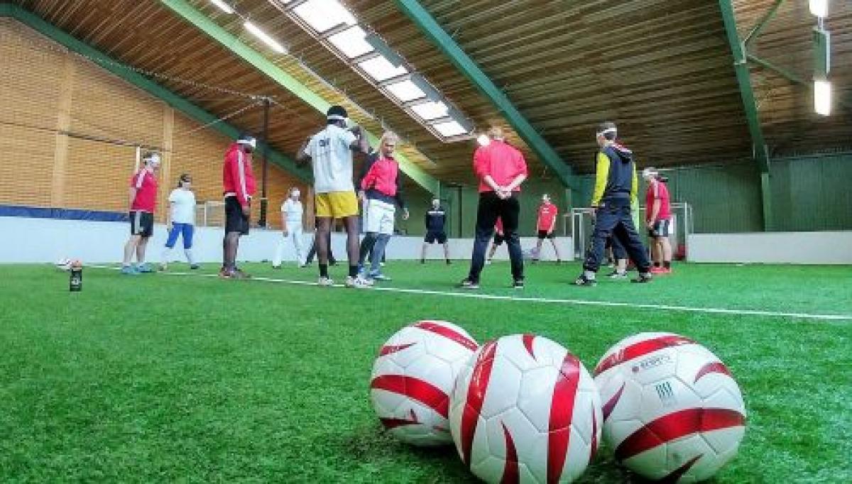 A female trainer coaches blind players in Vienna, Austria.