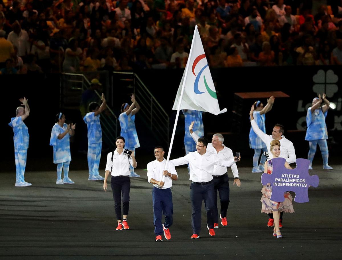 Flag bearer Ibrahim Al Hussein of Syria - Rio 2016 Opening Ceremony Flag bearer Ibrahim Al Hussein of Syria leads the Independent Paralympic Athletes team entering the stadium during the Opening Ceremony of the Rio 2016 Paralympic Games.