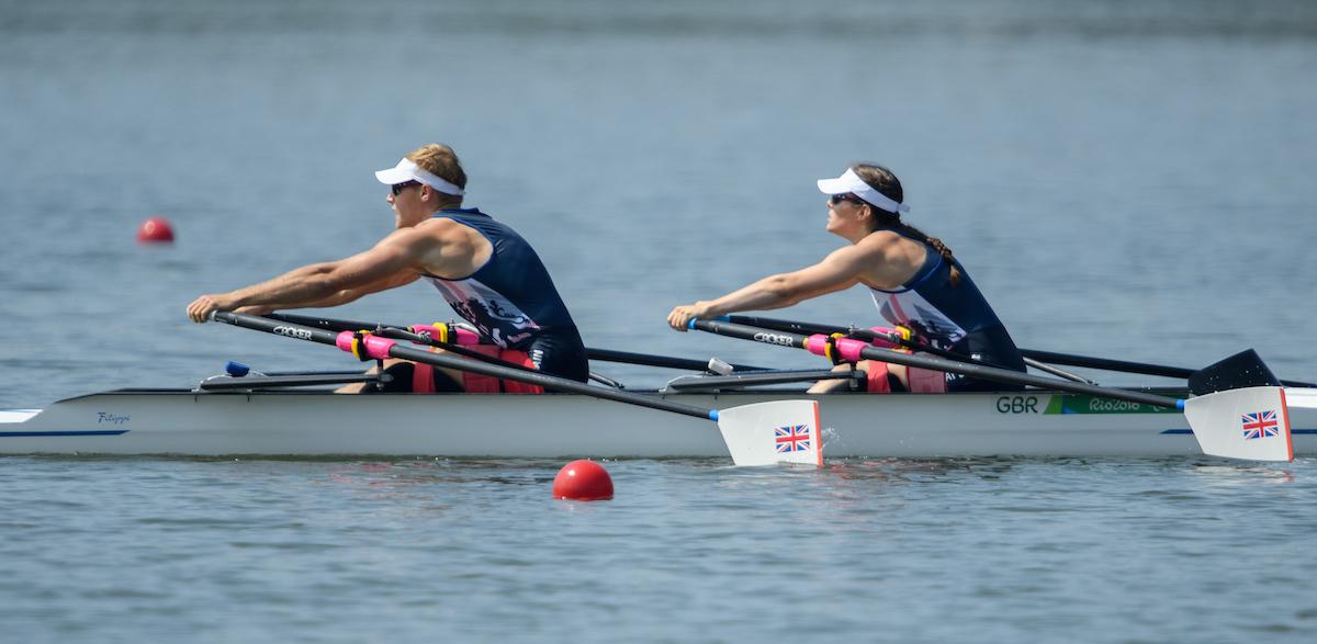 Two rowers in a boat on the water