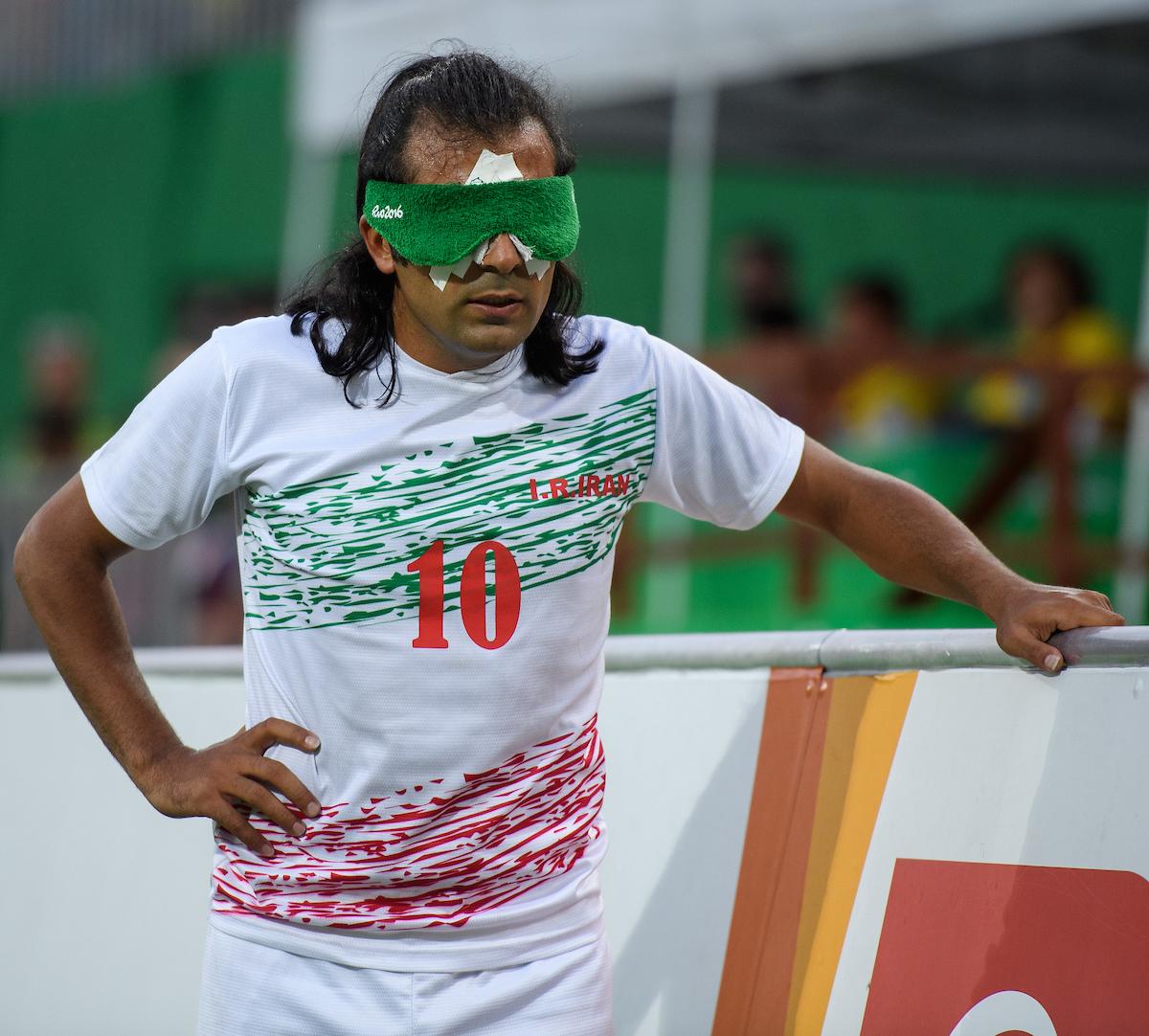 A blindfolded football 5-a-side player.