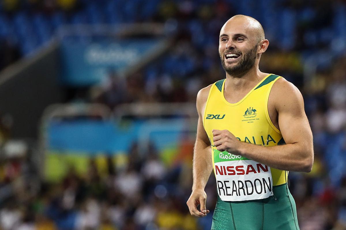 Scott Reardon of Australia celebrate winning the gold medal in the Men's 100m - T42 Final on day 8 of the Rio 2016 Paralympic Games