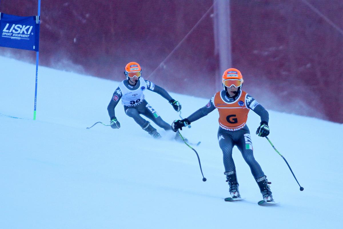 A visually impaired skier takes a bend