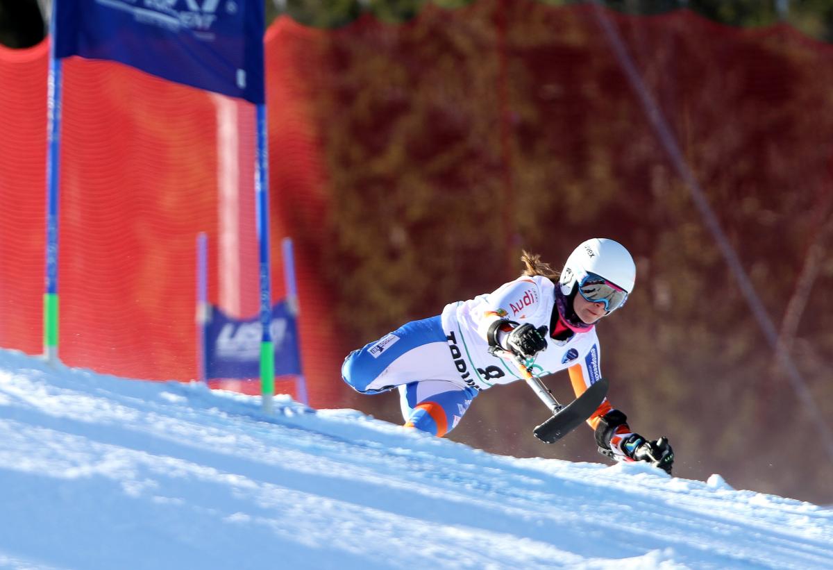 downhill skier going through a gate