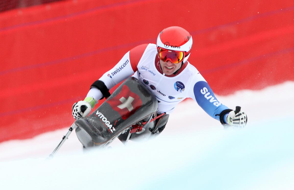 Man in sit ski in action on the slopes