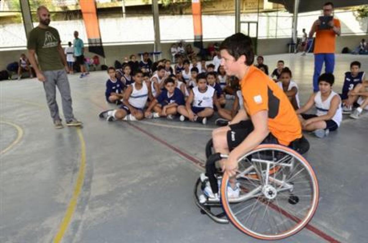 Inge Huitzing visits a school in Brazil Inge Huitzing, sitting in a wheelchair and playing basketball, visits a school in Brazil