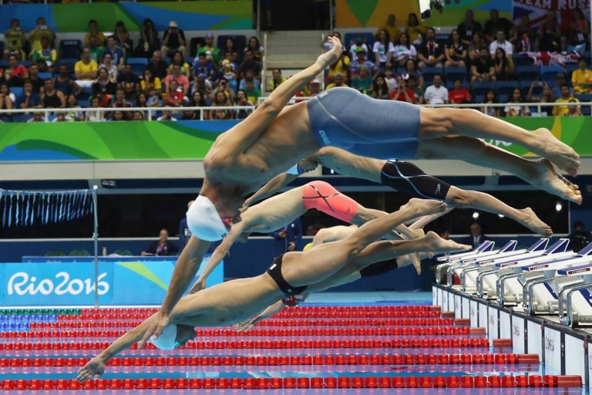 Swimmers dive to compete in the Men's 200m Individual Medley - SM8 Final at the Rio 2016 Paralympic Games.