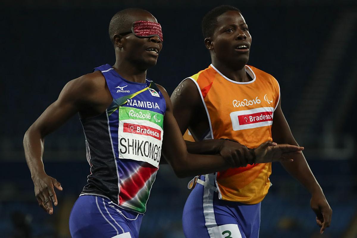 Ananias Shikongo Ananias Shikongo and his guide Even Tjiviju of Namibia celebrates winning the gold medal in the Men's 200m - T11 Final at the Rio 2016 Paralympic Games.