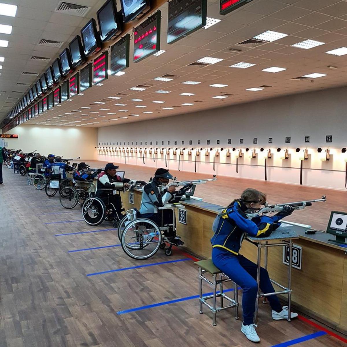 A series of Para sport shooters take aim on the shooting range