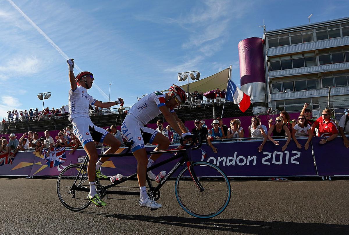 Ivano and Lucca Pizzi of Italy - London 2012 Ivano and Lucca Pizzi of Italy celebrate winning the Men's Individual B Cycling Road Race at the London 2012 Paralympic Games.