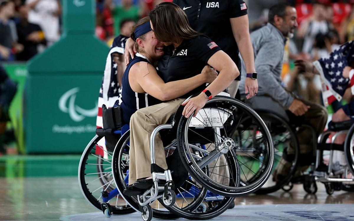 Stephanie Wheeler and Christina Schwab - basketball - USA Two women in wheelchairs hugging each other