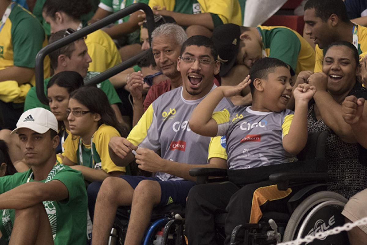 Sao Paulo 2017 - crowds A man and a boy in a wheelchair watch a wheelchair basketball competition