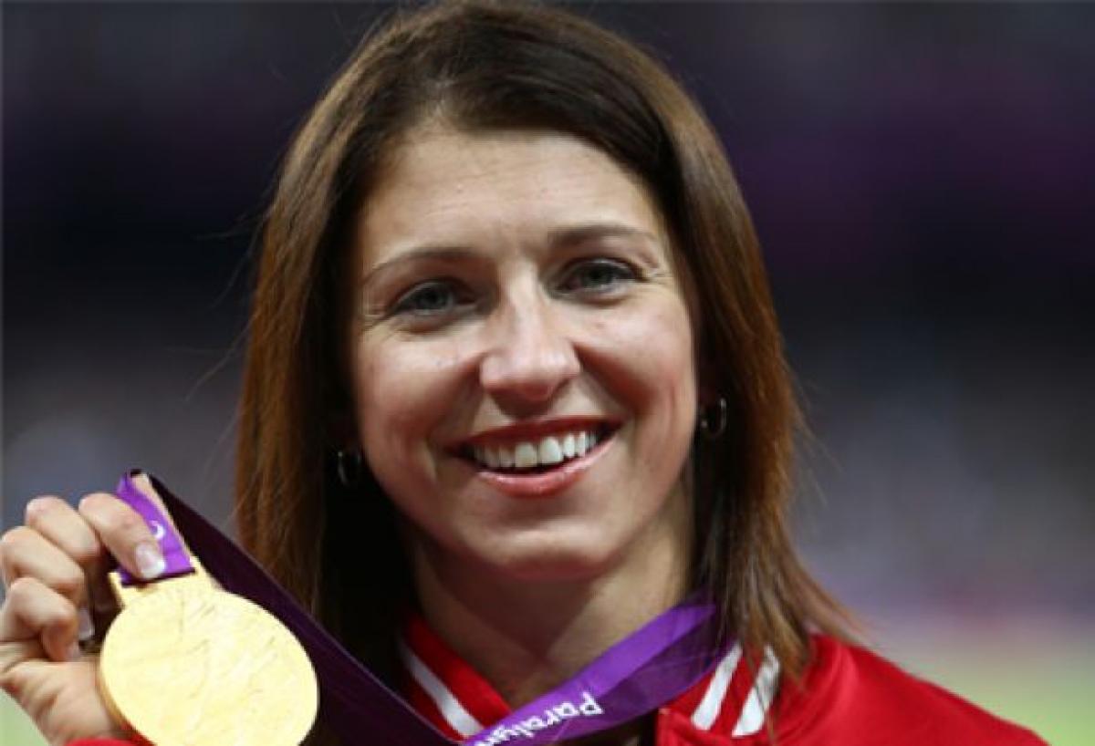 Michelle Stilwell A picture of a woman showing her gold medal