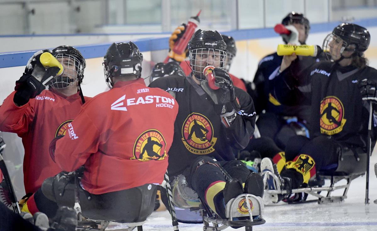 a group of Para ice hockey athletes on the ice