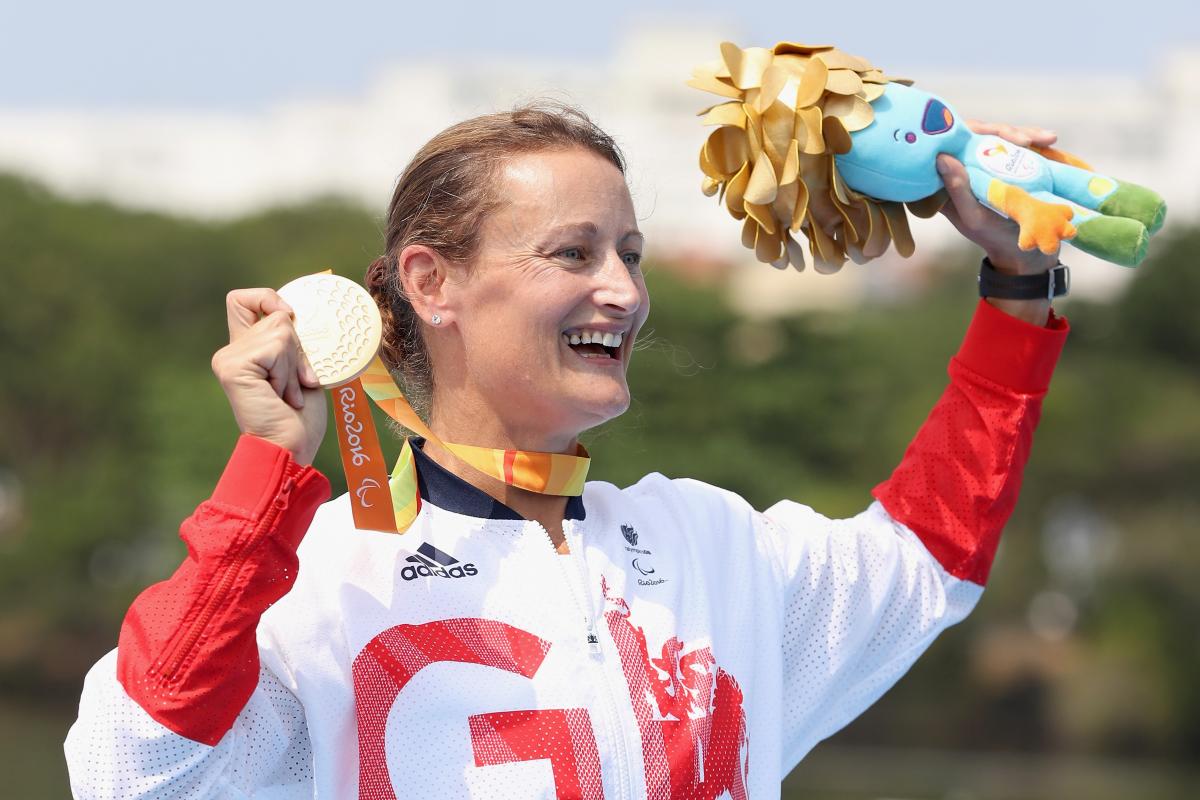Great Britain's Anne Dickens celebrates on the medals podium after winning the women's KL3 canoe final at the Rio 2016 Paralympic Games.