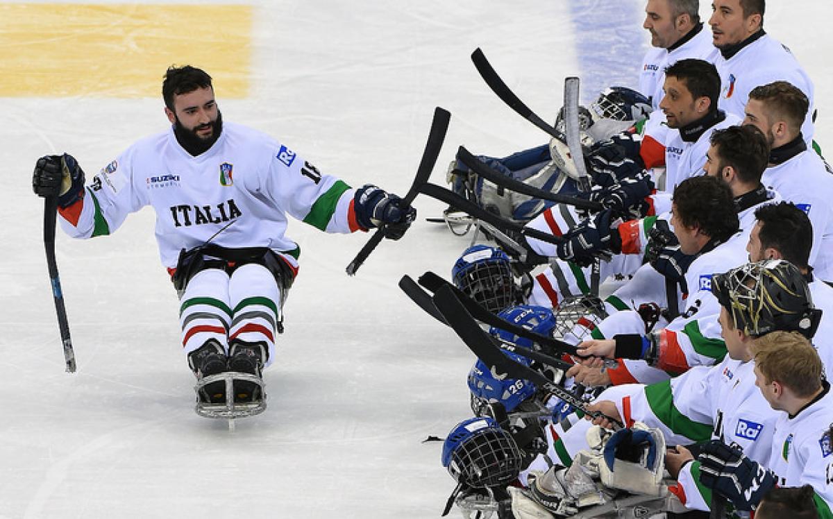 A Para ice hockey player celebrates a game win