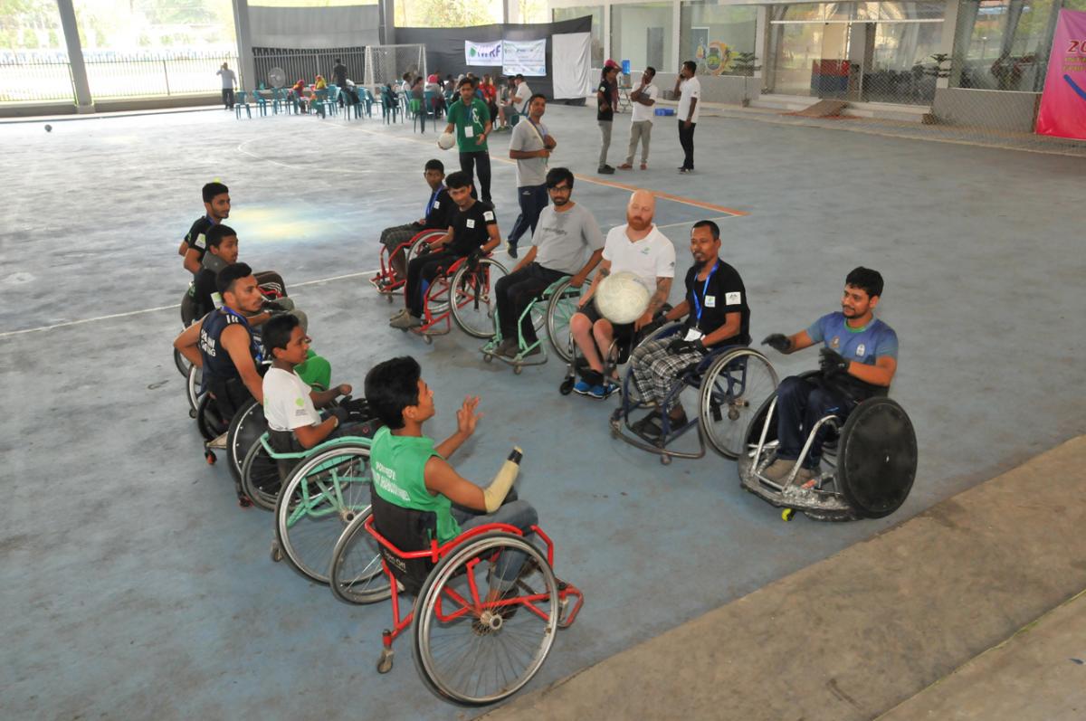 Men in wheelchairs line up for a drill