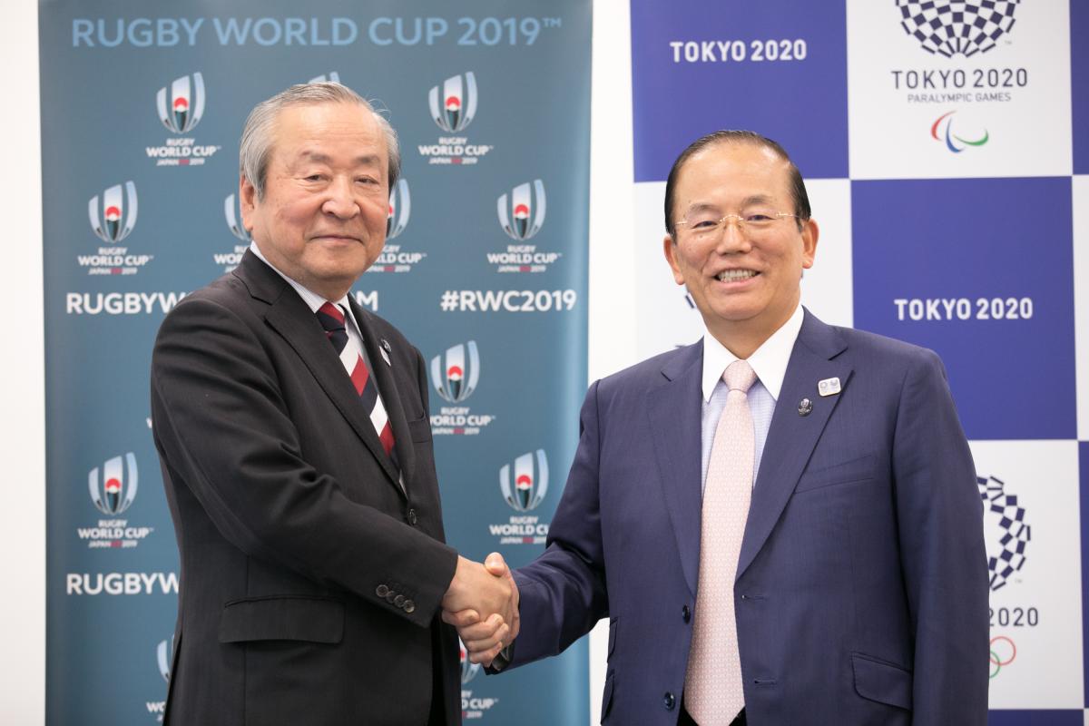 Tokyo 2020 and Rugby World Cup 2019 Two men shaking hands
