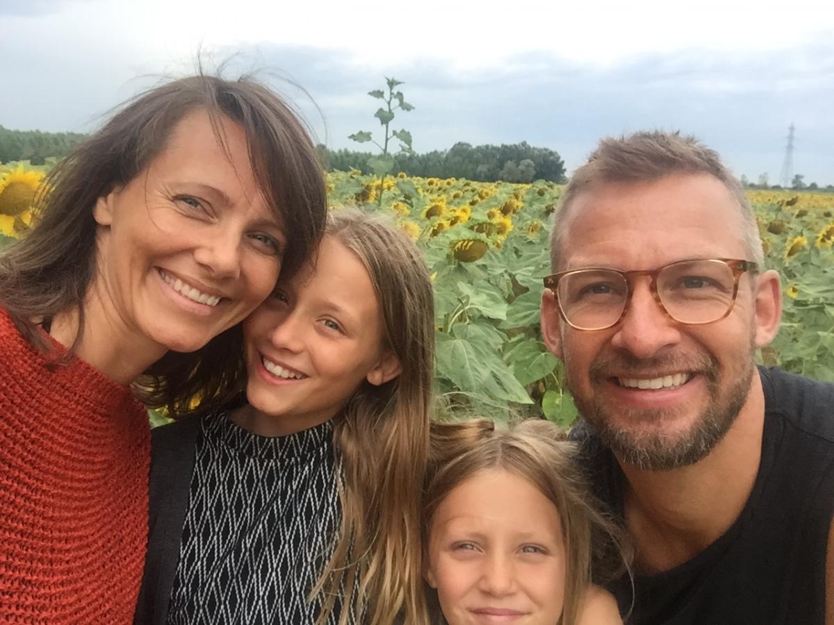 Selfie of a woman, her husband and their two daughters