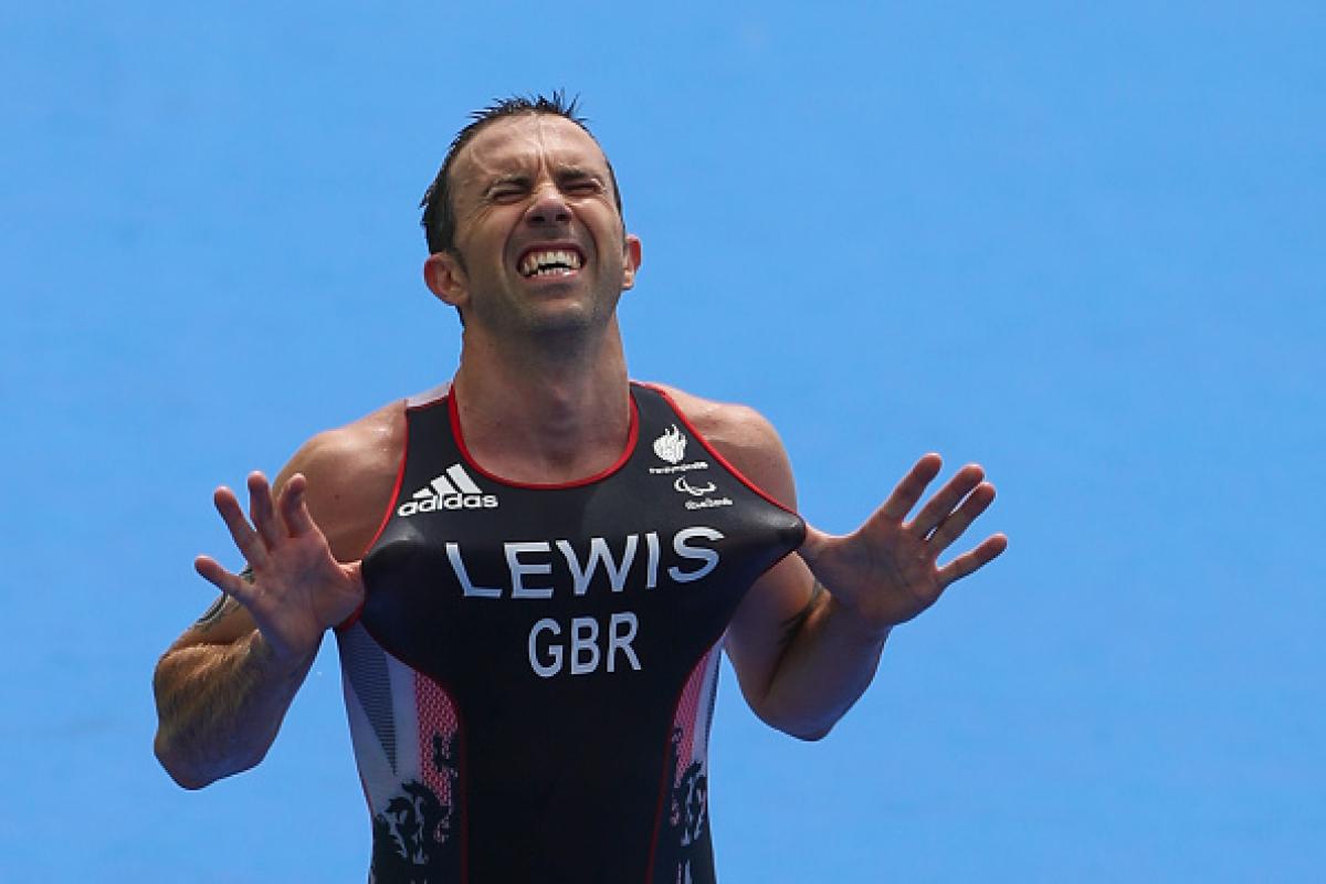 Andrew Lewis - Great Britian triathlon Male triathlete celebrates after winning race