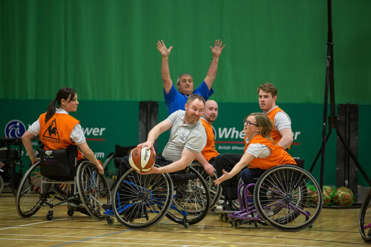 People playing wheelchair basketball