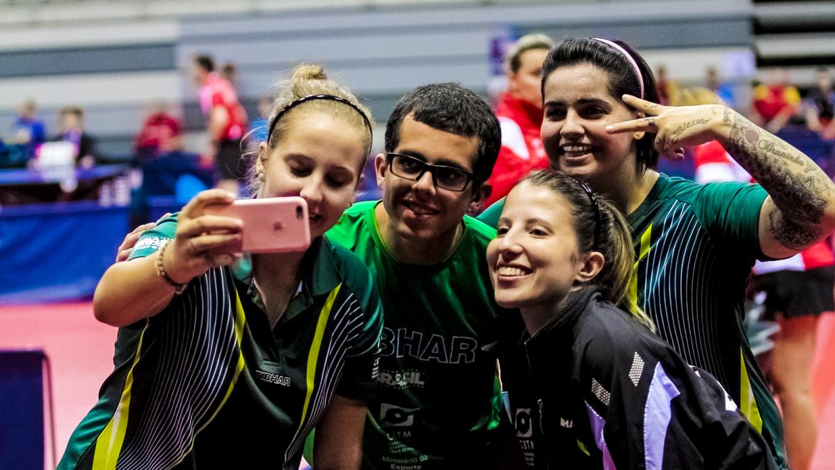 Brazil's Bruna Costa Alexandre, Danielle Rauen and Jennfyer Marques - table tennis Four people take a selfie