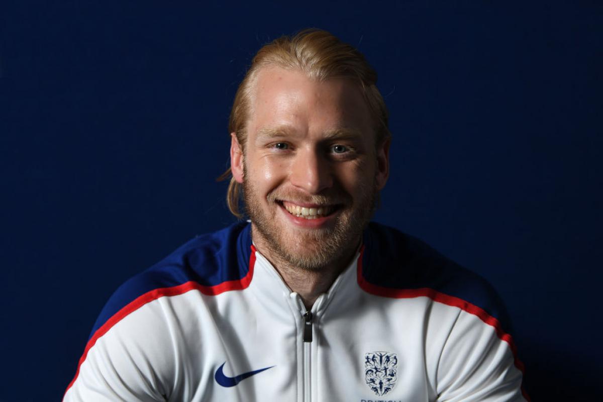 Jonnie Peacock smiles for the camera at team announcement for London 2017