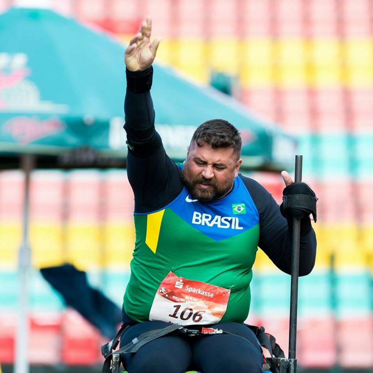 wheelchair athlete prepares to throw shot put