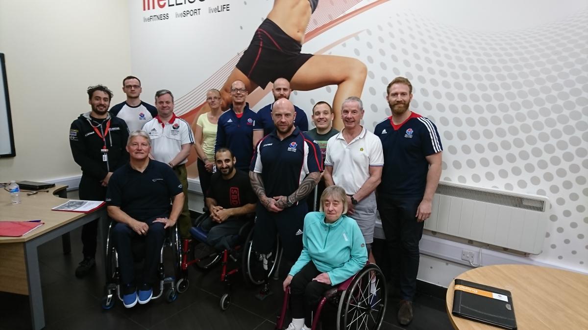 Powerlifting referee course - Manchester a group of referees smile for the camera
