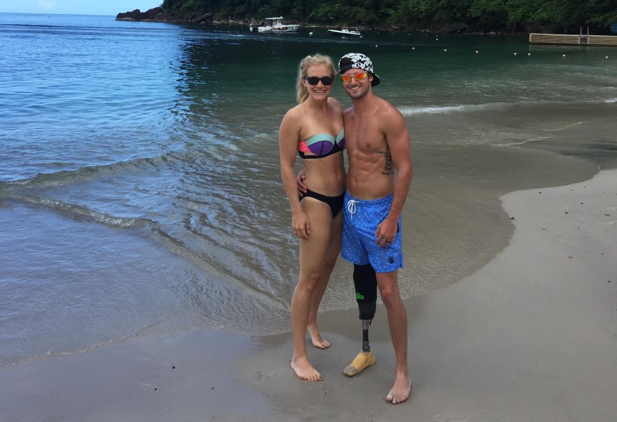 Holiday Hotspot - Jarryd Wallace a man and a woman in swimsuits on a beach
