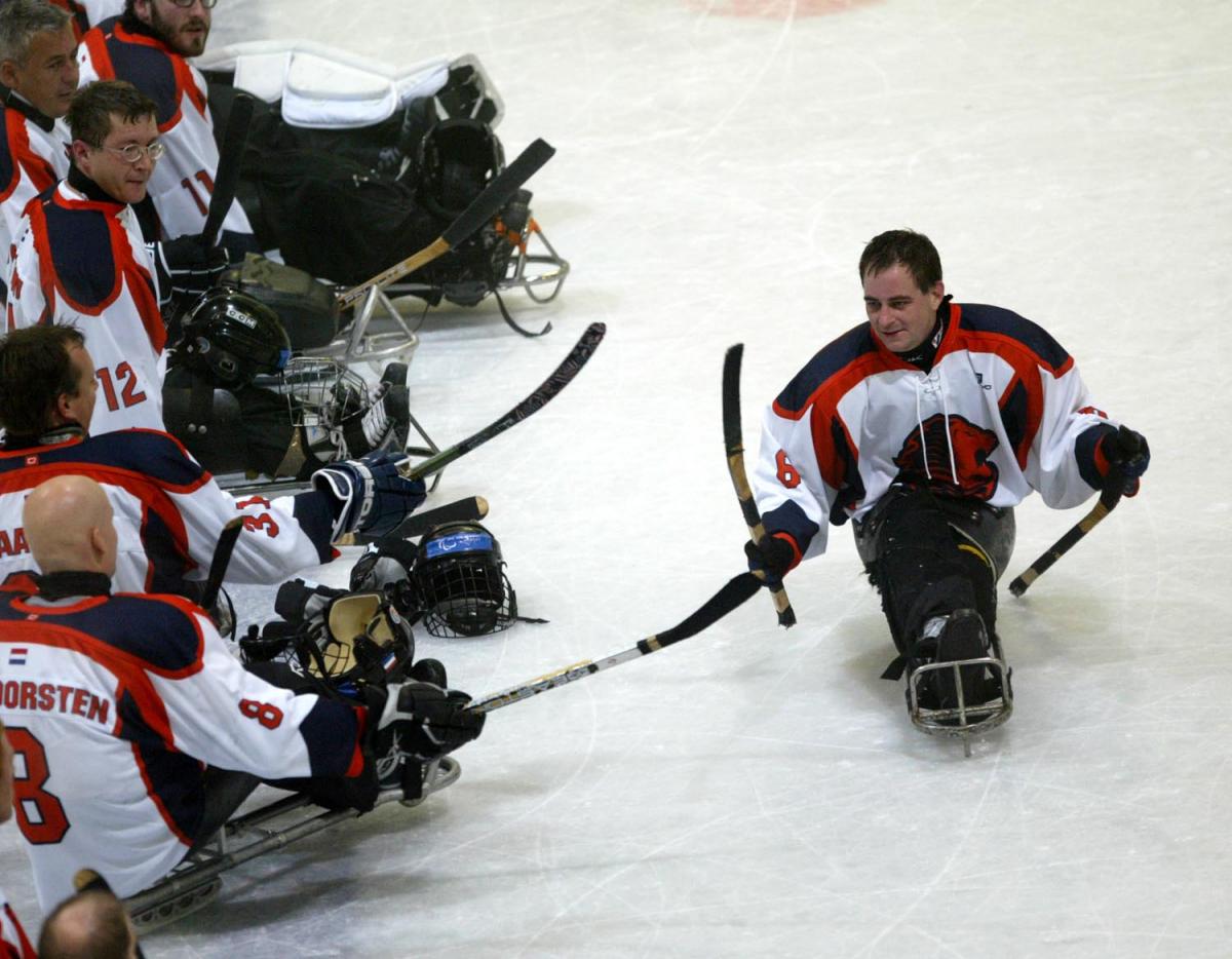 para ice hockey players on the ice