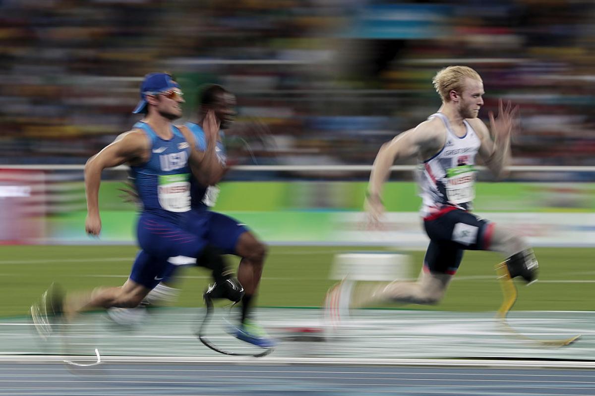Jonnie Peacock - Rio 2016 three para sprinters run towards the finish line