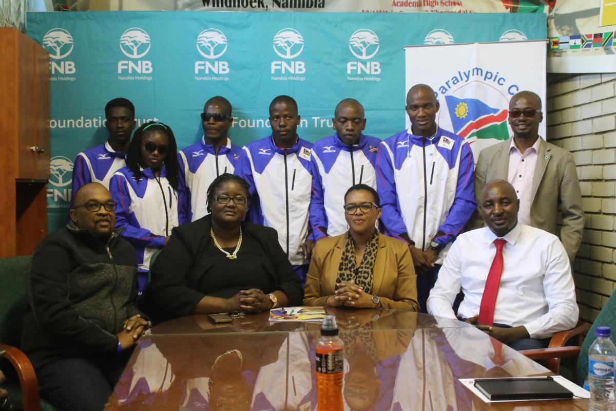 Namibia investment a group of Para athletes and officials pose for a photo