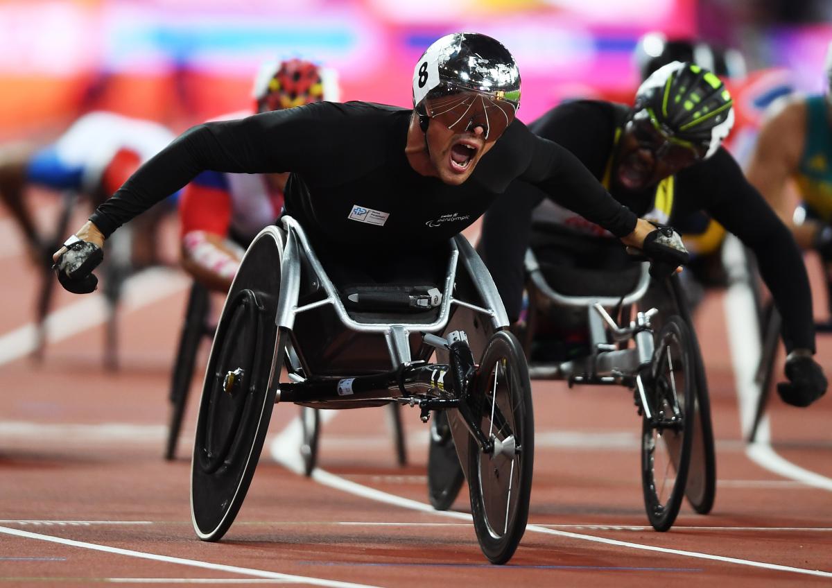 Switzerland's Marcel Hug celebrates after taking the 1,500m T54 world title at London 2017.