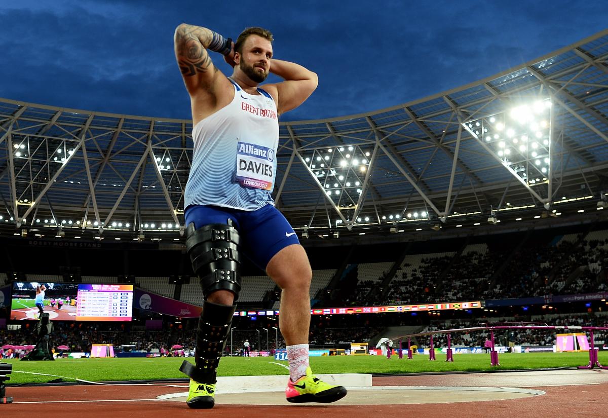 An athlete celebrates winning gold