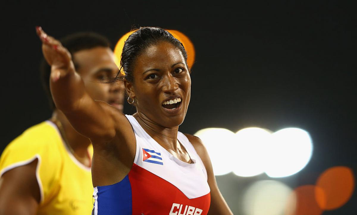 A female Para athlete celebrates after her race