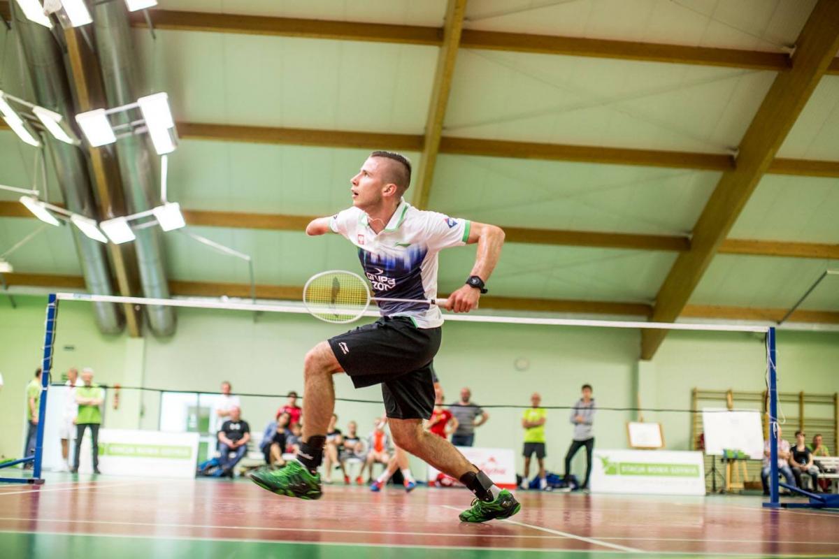 a Para badminton player goes for a shot