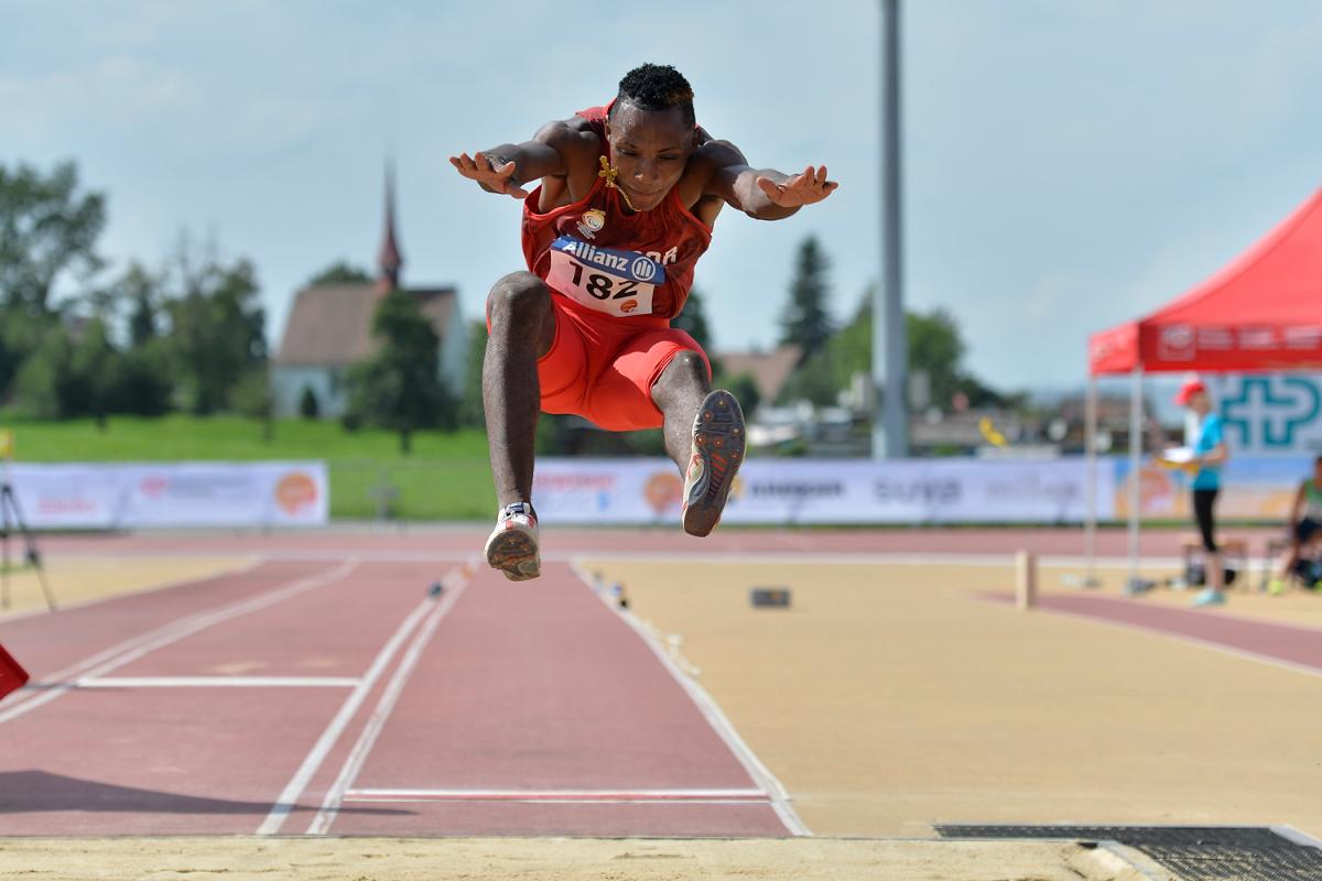 Man competing in long jump event