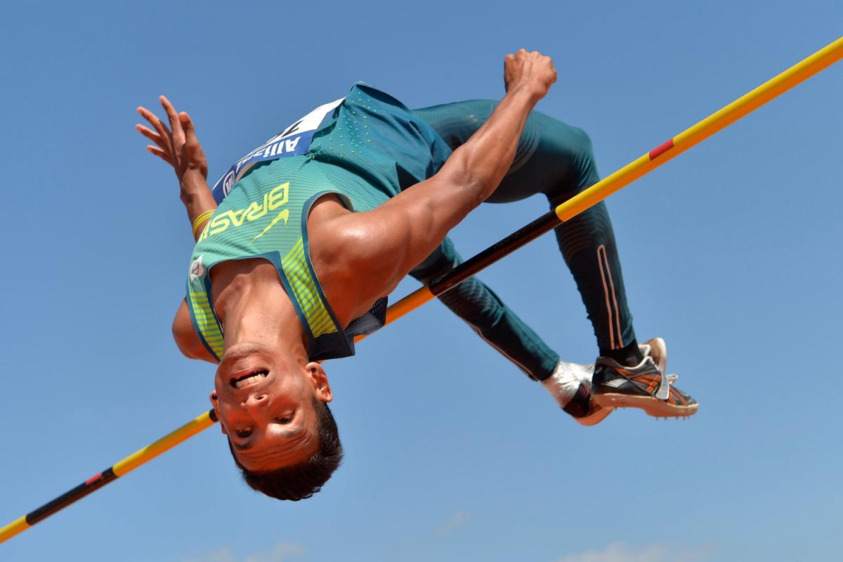 Brazilian athlete clears a bar in the high jump