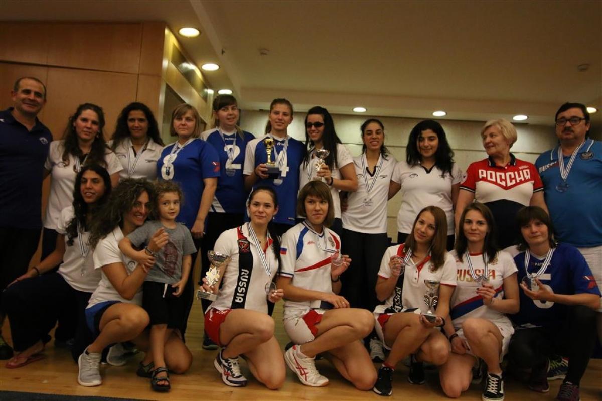 a group of goalball athletes smile for the camera