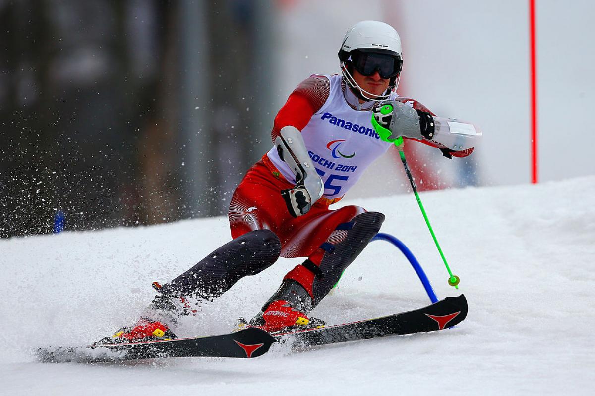 a Para skier goes through a gate