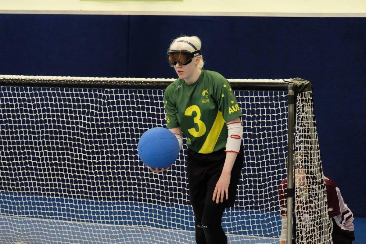 Aussie Belles goalball A female goalball player holds the ball