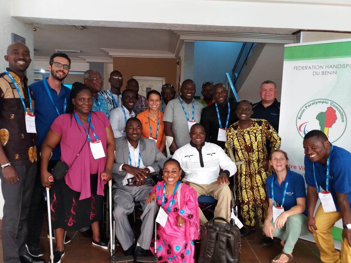 Benin OCP - Agitos Foundation a group of officials smile for the camera